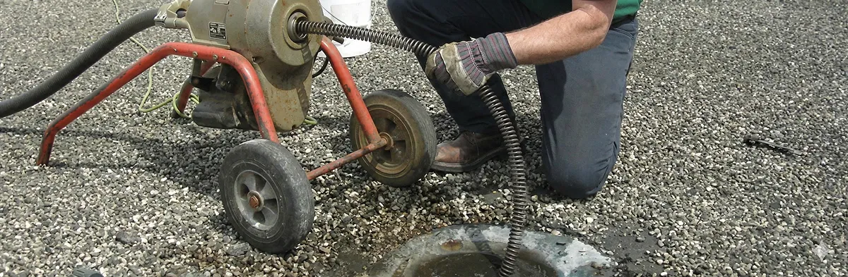 sewer rodding technician actively removing blockages from a sewer line in Fort Lauderdale, FL