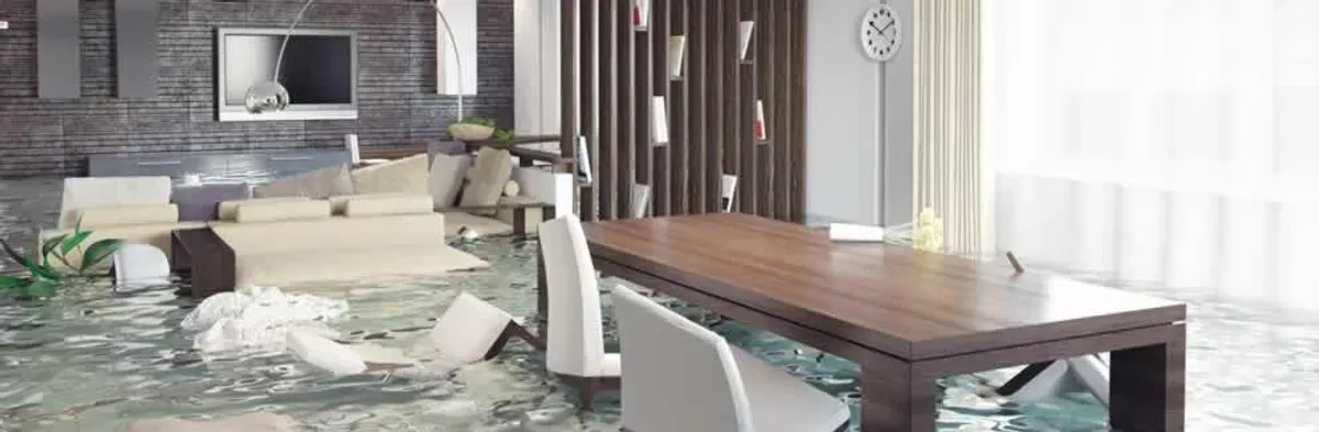 home interior affected by water damage with flooded floors and displaced furniture in Fort Lauderdale, FL